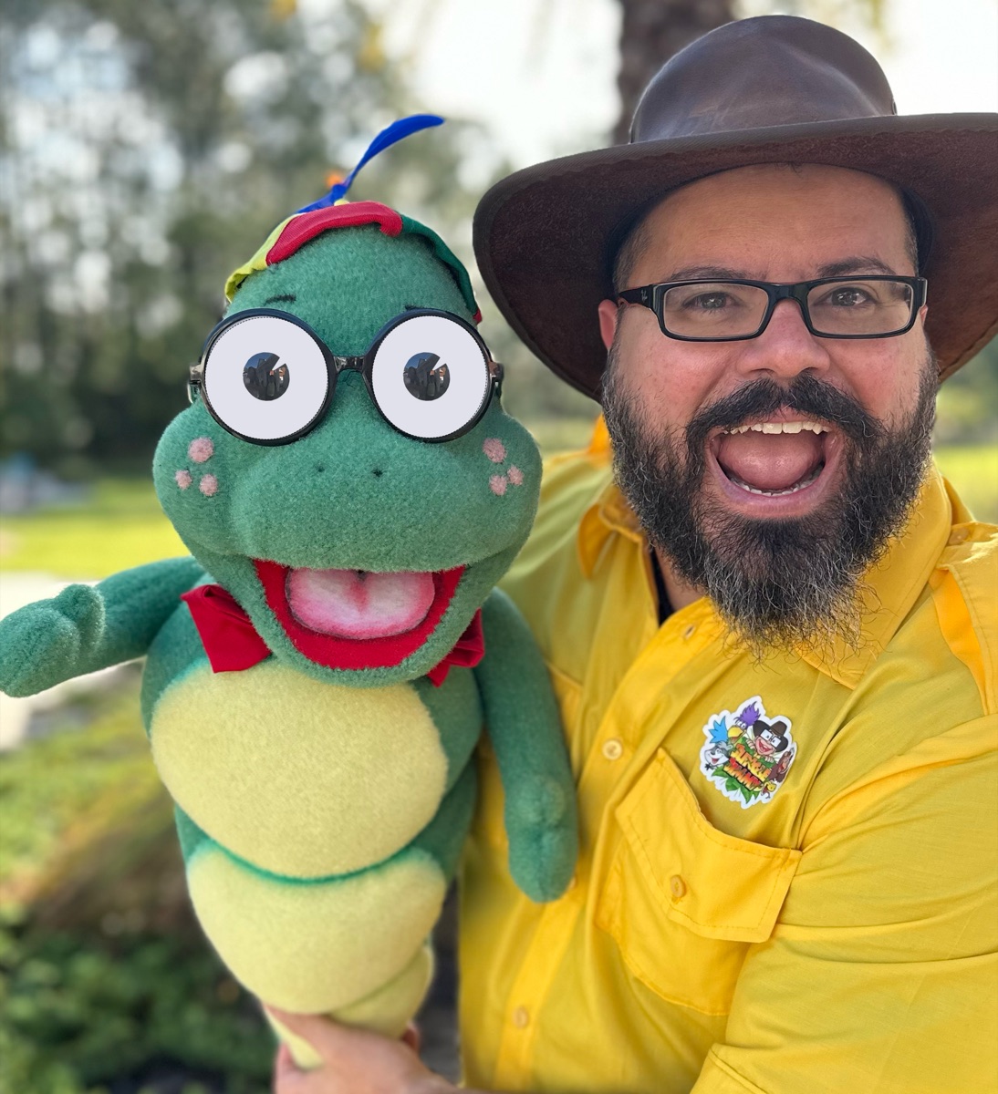 Author Jimmy Vee with ReadIT the Bookworm puppet